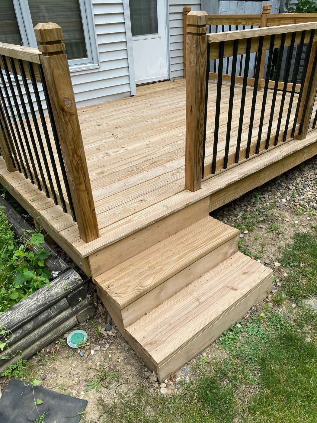 Finished wood deck steps and railing
