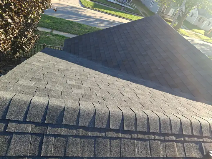 Completed dark architectural shingle roof